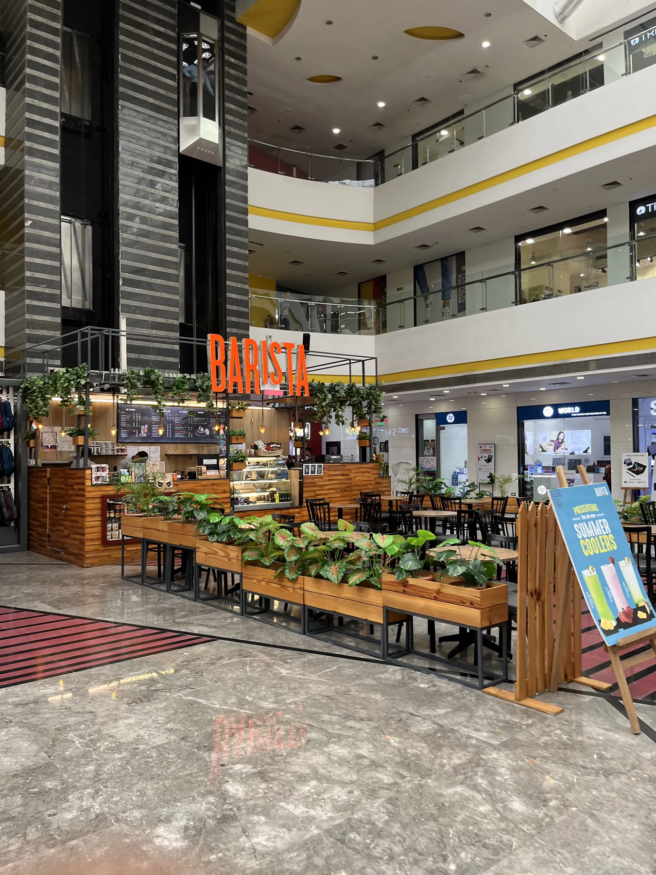 Coffee stop at a Barista cafe inside a mall atrium