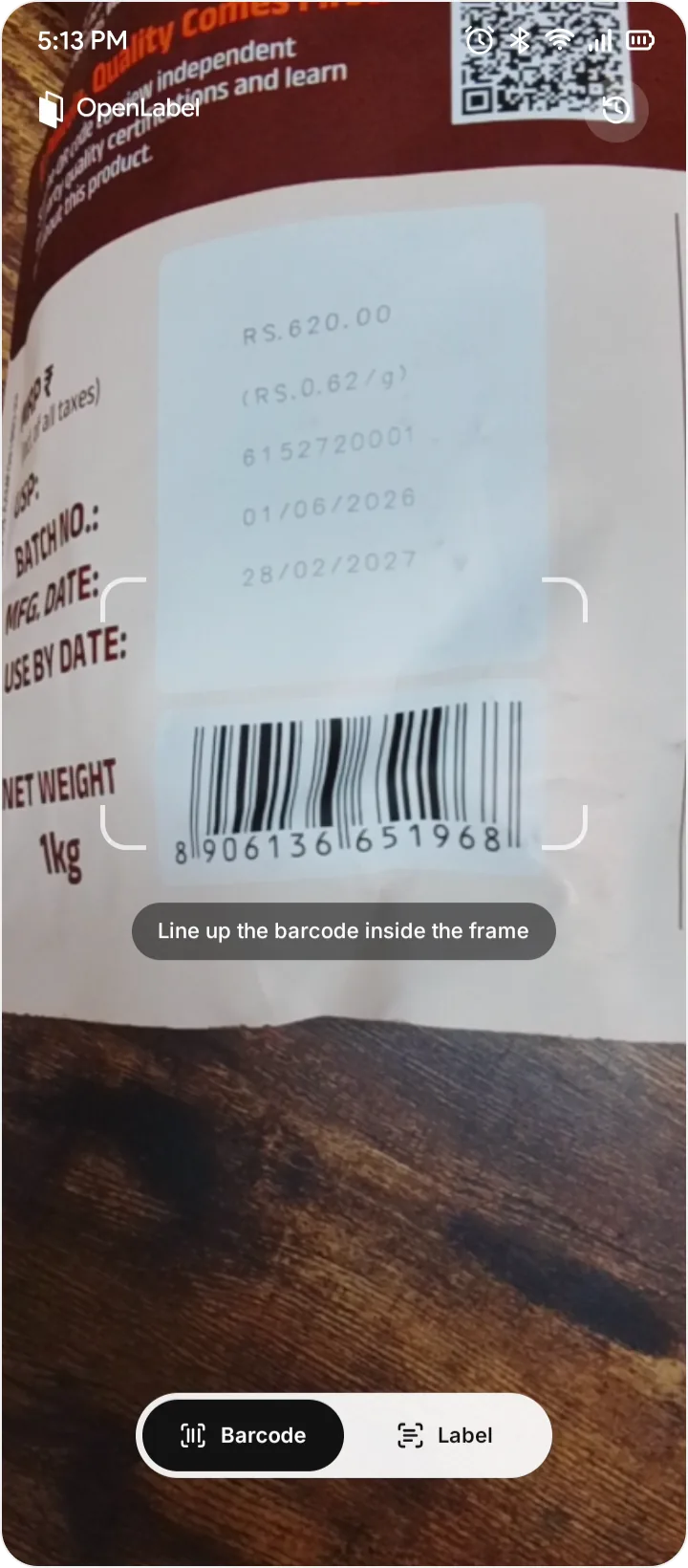 OpenLabel scanner lining up a product barcode inside the frame